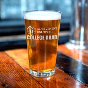Achievement Unlocked College Grad - Funny College Graduation Gamer Gift. Gamer College Grad Pint Glass. Graduation Gift Beer Glass. Congrats