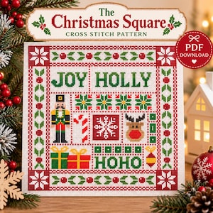 May include: A square cross stitch pattern titled The Christmas Square featuring a red and green border with holly motifs. The design includes the text JOY HOLLY and HOHO, a nutcracker, a candy cane, a snowflake, a reindeer, and two gift boxes.