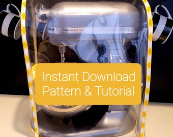 May include: A clear plastic cover with a yellow and white checkered border protects a silver stand mixer. The mixer has the text "Professional 5 Plus" on it. A yellow rectangle with the text "Instant Download Pattern & Tutorial" is in front of the mixer.