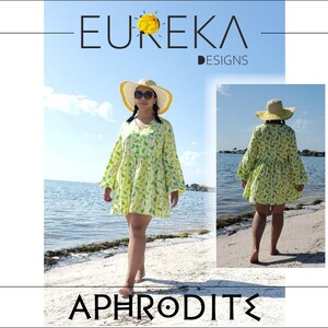 May include: A woman's beach cover-up dress with a V-neck and long sleeves, in a light green and white pattern. The dress is paired with a straw hat with a yellow brim. The image includes the text "EUREKA DESIGNS" and "APHRODITE".