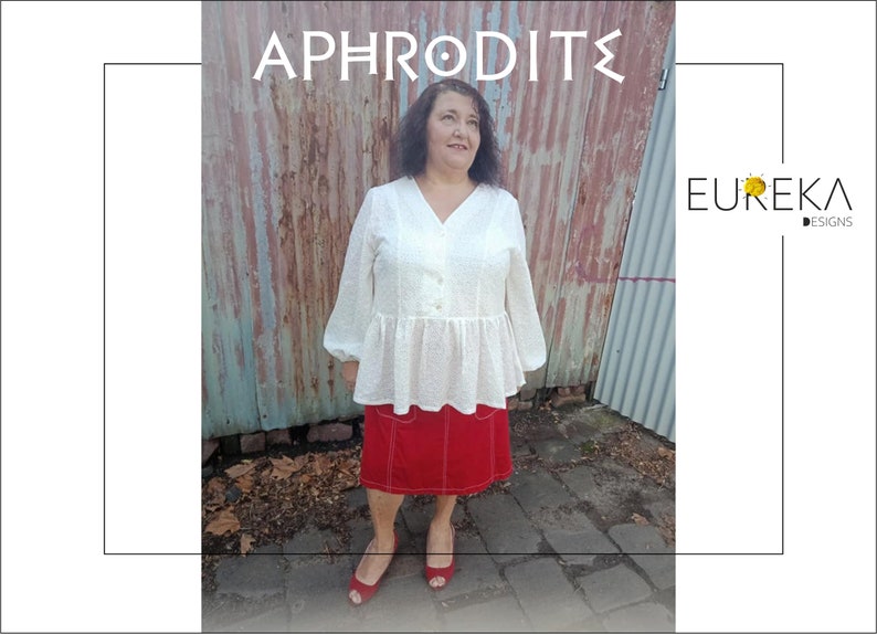 May include: A woman wearing a white blouse and a red skirt. The blouse has a V-neck and long sleeves. The skirt is red with white stitching. The text "APHRODITE" is at the top, and the "EUREKA DESIGNS" logo is on the right.