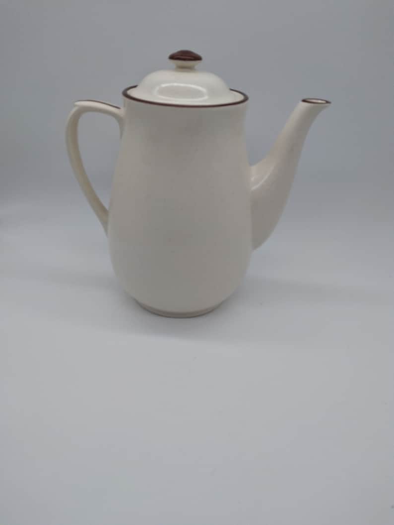 Beige Teapot Brown Edging with Floral Design