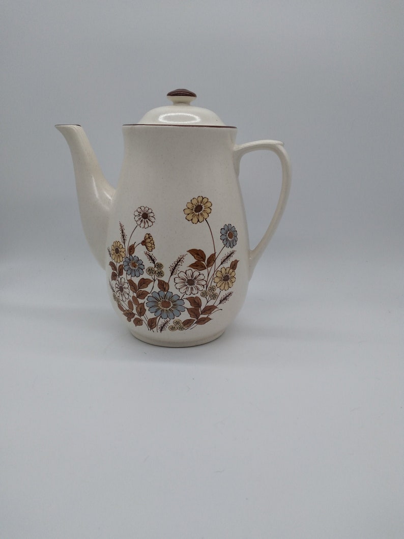 Beige Teapot Brown Edging with Floral Design