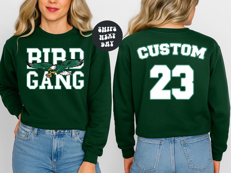 A woman wearing a green sweatshirt with the text "BIRD GANG" and the number "23" printed on it.