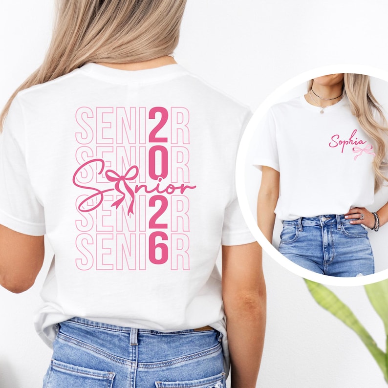 A woman wearing a white t-shirt with the text "SENIOR 2016" printed on it, along with a pink ribbon symbol.