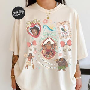 a person wearing a white t-shirt with various colorful illustrations and text.