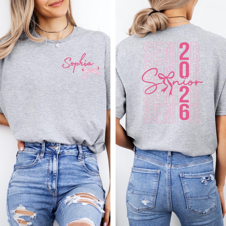A woman wearing a grey t-shirt with the text "Sophia" and "Graduation 2016" printed on it, along with a pink ribbon design.
