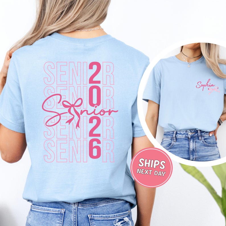 A woman wearing a light blue t-shirt with the text "SENIOR 2016" printed on it, along with a pink ribbon symbol.