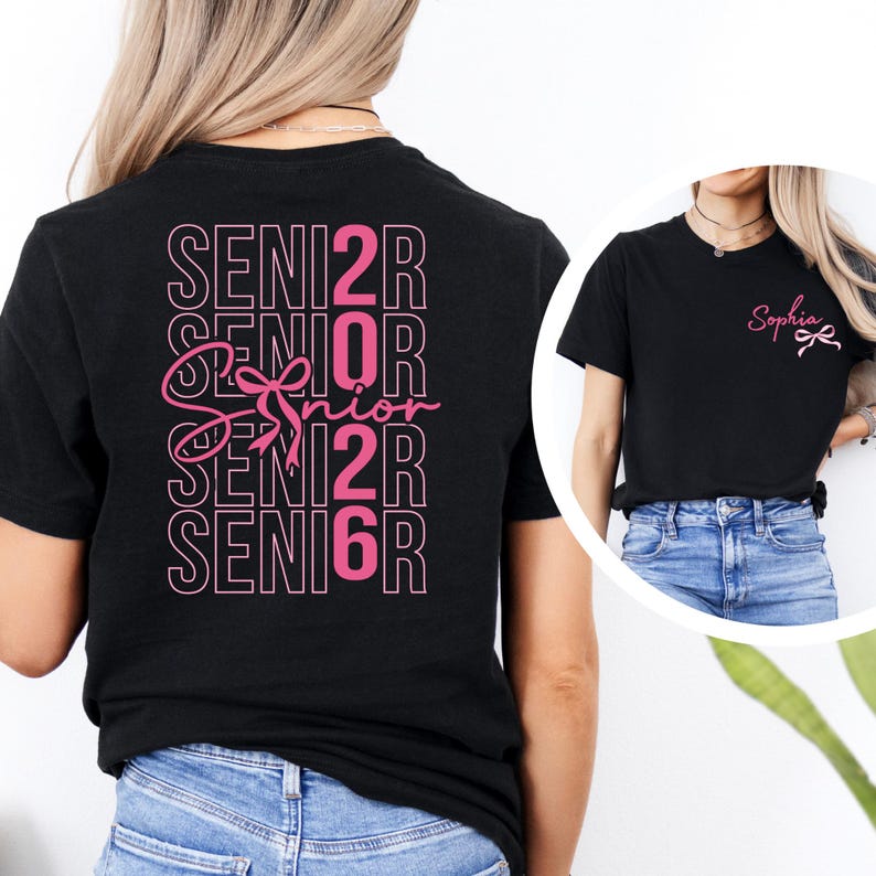 a woman wearing a black shirt with pink letters on it