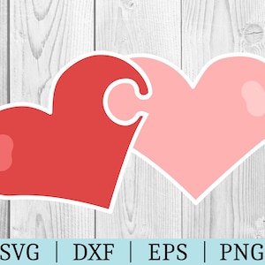 May include: Two interlocking red and pink hearts, shaped like puzzle pieces, against a white woodgrain background.