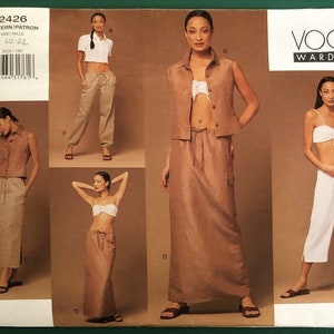 May include: A sewing pattern for a women's clothing set. The pattern includes a skirt, pants, and a top. The pattern is for sizes 18-20-22. The pattern is from Vogue Wardrobe and the pattern number is 2426.