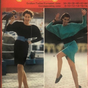 Peut inclure: Un patron de couture Burda Super-Easy vintage, numéro 5663, avec des illustrations de deux femmes portant des robes. Le patron comprend les tailles 34-44 et les tailles européennes correspondantes 8-18. La couverture est rouge avec du texte blanc et jaune.