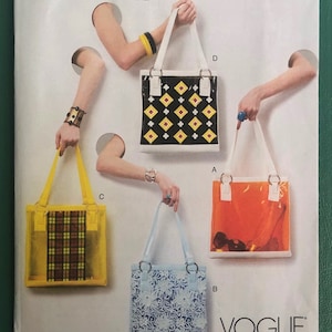 May include: Four different tote bag patterns for Vogue Patterns accessories. The bags are all clear and feature different patterns: plaid, floral, geometric, and a solid color. The bags are shown on a white background.