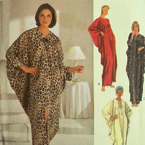 May include: Simplicity at Home sewing pattern number 5788 for a long, loose-fitting robe with a tie at the neck. The pattern includes four different styles: a leopard print robe, a red robe, a floral print robe, and a white robe.