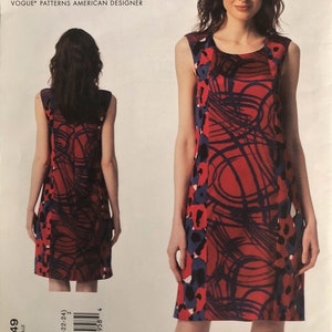 May include: DKNY Donna Karan New York Vogue Patterns American Designer sewing pattern for a sleeveless dress with a red, black, and blue abstract print. The pattern number is V1349.