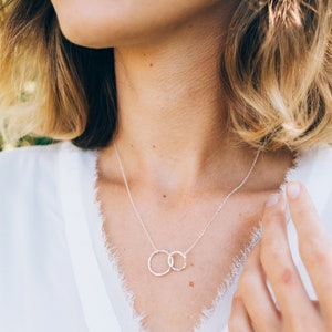 Show your love and appreciation with our sterling silver friendship necklace. it is 18 inches long with an adjustable ring at 16 inches and features eternity circles. it is the perfect gift for a best friend, symbolizing everlasting bonds.