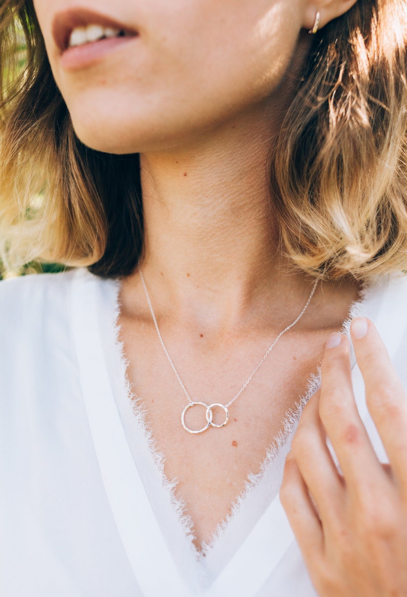 Show your love and appreciation with our sterling silver friendship necklace. it is 18 inches long with an adjustable ring at 16 inches and features eternity circles. it is the perfect gift for a best friend, symbolizing everlasting bonds.