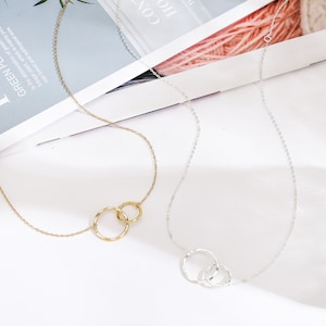 Strengthen the bond with a sister-in-law by gifting this timeless Unbiological Sisters Necklace. Crafted from 14k gold and sterling silver, this high-quality piece reflects love and trust, a treasured gift she will cherish for years.