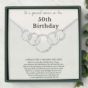 The Sterling Silver necklace for 50th birthday gift for her with 5 interlocking circles. The necklace is 18 inches long with an adjustable ring at 16 inches. The pendant measures 2.3 inches in width and 0.65 inches in height.