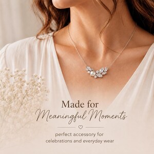 May include: A silver necklace with a pearl and crystal pendant. The pendant is shaped like a stylized flower or leaf arrangement. The image includes the text "Made for Meaningful Moments" and "perfect accessory for celebrations and everyday wear."