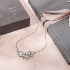 This captivating sterling silver necklace features a luminous pearl accented by sparkling cubic zirconia, a perfect gift for stepmom. The 18 inch length flatters any neckline and is presented in a beautiful jewelry box.