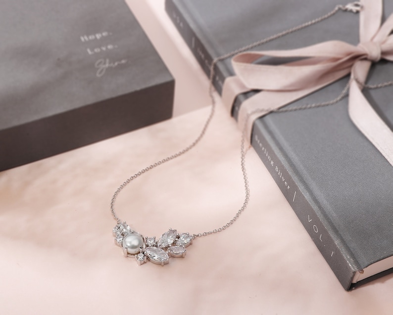 This captivating sterling silver necklace features a luminous pearl accented by sparkling cubic zirconia, a perfect gift for stepmom. The 18 inch length flatters any neckline and is presented in a beautiful jewelry box.