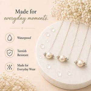 May include: Three silver necklaces with a large pearl pendant and small crystal accents. The image includes text that says "Made for everyday moments", "Waterproof", "Tarnish Resistant", and "Made for Everyday Wear".