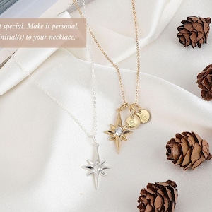 a couple of necklaces sitting on top of a table