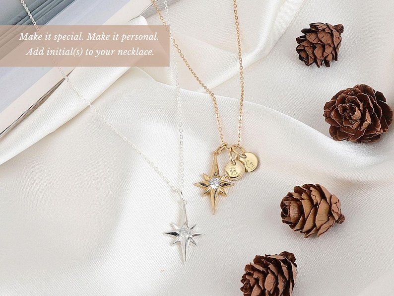 a couple of necklaces sitting on top of a table