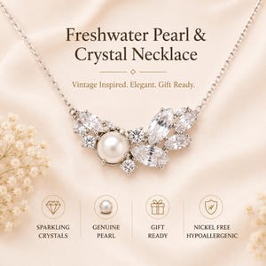 May include: A silver necklace with a freshwater pearl and crystal pendant. The pendant features a large, round pearl surrounded by sparkling crystals. Text on the image reads "Freshwater Pearl & Crystal Necklace" and "Vintage Inspired. Elegant. Gift Ready."