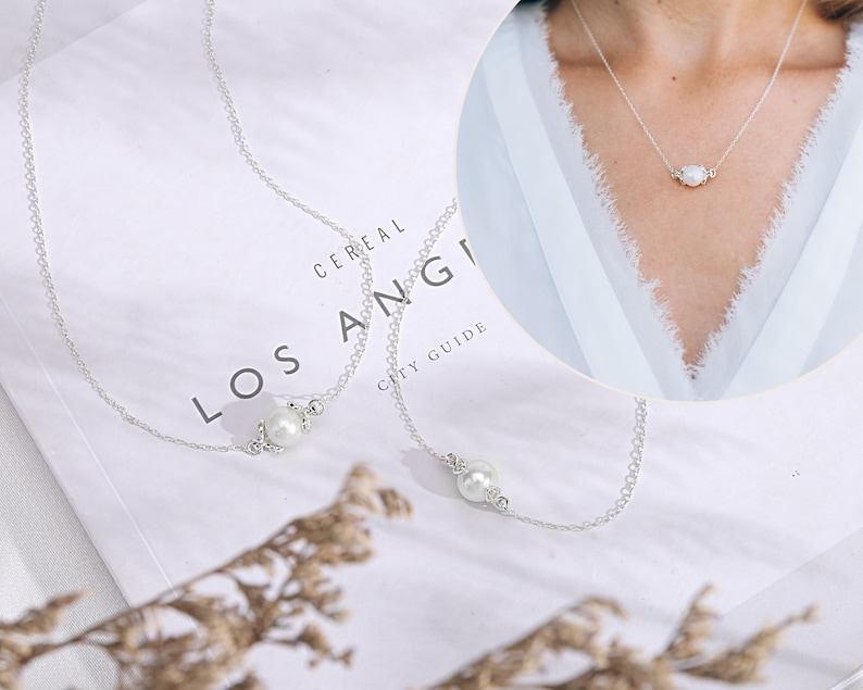 This delicate sterling silver pearl necklace is a perfect Bonus Mother Necklace Gift. The 18 inch chain with an adjustable loop at 16 inches allows for a personalized fit. The beauty of the pearl makes it a treasured gift that she can wear every day.