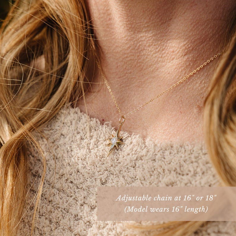 a close up of a person wearing a necklace
