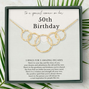 Honor her milestone with our exquisite 5-ring necklace, crafted with 14k gold vermeil and beautifully packaged in our custom-designed jewelry box. This heartfelt gift is sure to become a treasured keepsake for the special woman in your life.