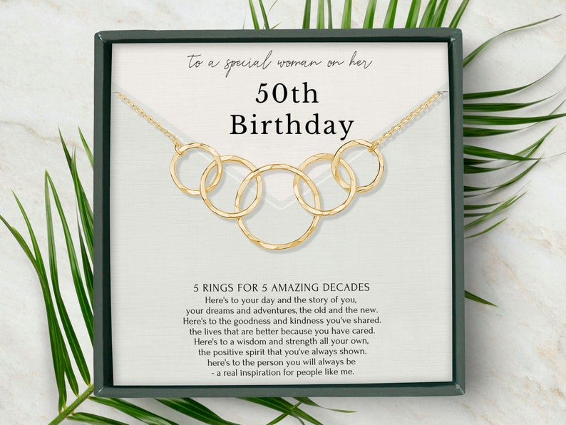 Honor her milestone with our exquisite 5-ring necklace, crafted with 14k gold vermeil and beautifully packaged in our custom-designed jewelry box. This heartfelt gift is sure to become a treasured keepsake for the special woman in your life.