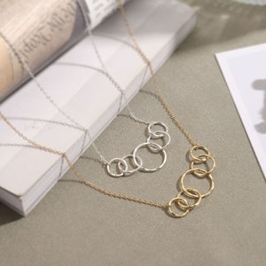 Celebrate her 50th birthday with our meaningful 5-interlocking circle necklace, representing five decades of love and laughter. Crafted with care from sterling silver and 14k gold vermeil, this elegant necklace is the perfect gift for her birthday.