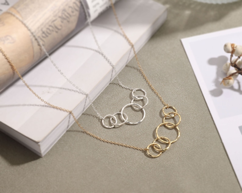 Celebrate her 50th birthday with our meaningful 5-interlocking circle necklace, representing five decades of love and laughter. Crafted with care from sterling silver and 14k gold vermeil, this elegant necklace is the perfect gift for her birthday.