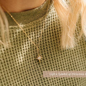 a close up of a person wearing a sweater
