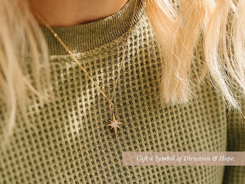 a close up of a person wearing a sweater