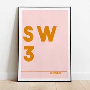 May include: A pink and orange poster with the text "SW3 LONDON" in a bold, sans-serif font.