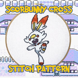 May include: A cross-stitch pattern featuring Scorbunny, a fire-type Pokemon, in a white hoop. The pattern is surrounded by a pixelated background with houses and snow.