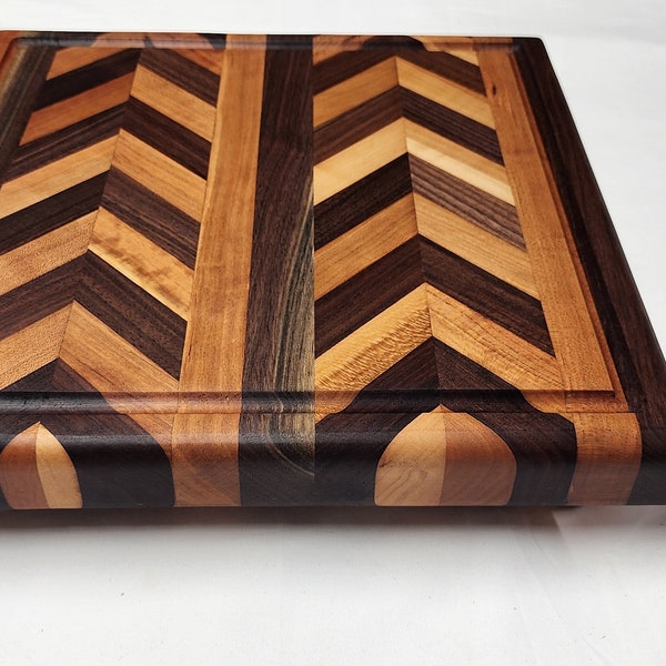 Cutting Board in Cherry and Black Walnut | Handcrafted medium size cutting board with Chevron Pattern | Herringbone pattern chopping block