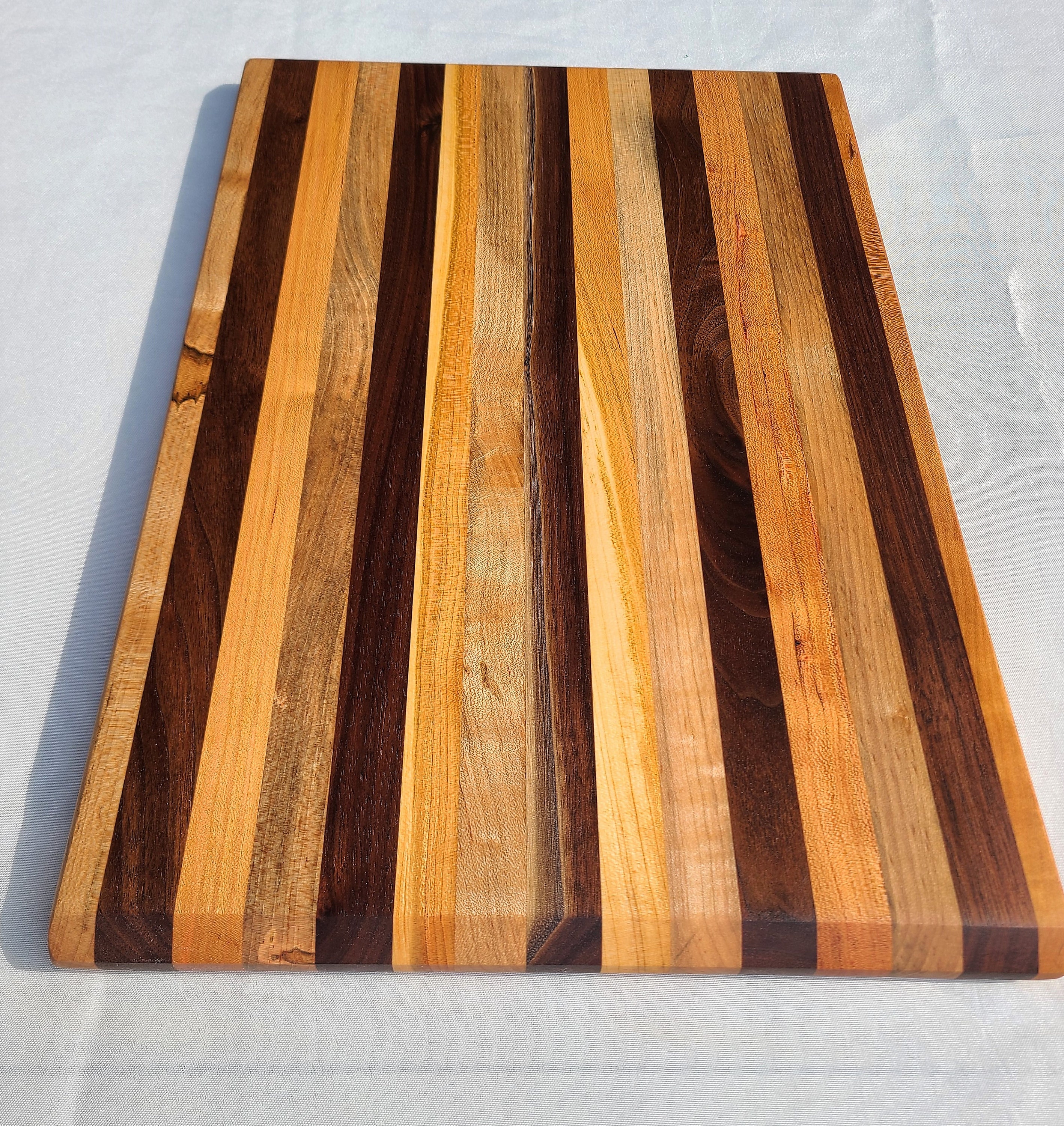 Set of 4 wooden coasters made with Ambrosia Maple. Beveleded edges
