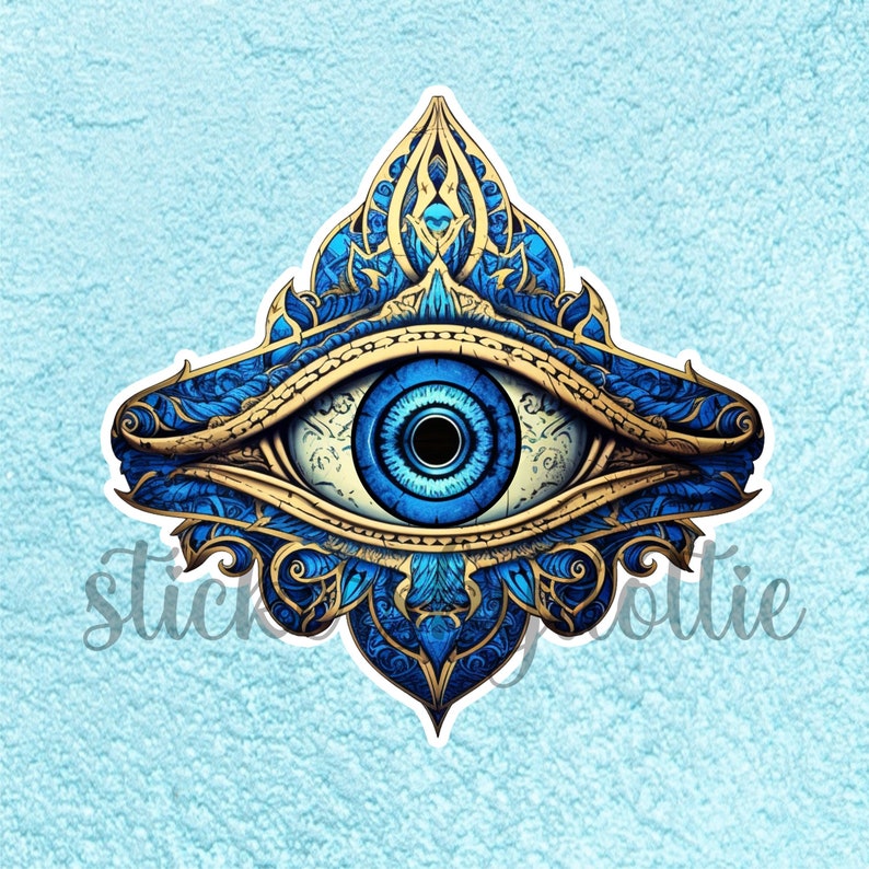 May include: A blue and gold evil eye with intricate details. The eye is surrounded by a decorative frame with a floral pattern.