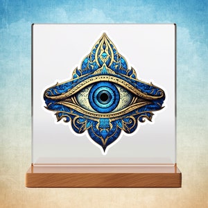 May include: A blue and gold evil eye with intricate details, a popular symbol of protection against negative energy.
