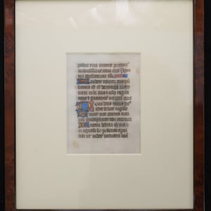 15th century Latin manuscript leaf on vellum, framed in a burr walnut wood photo frame