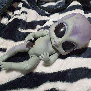 realistic alien baby doll