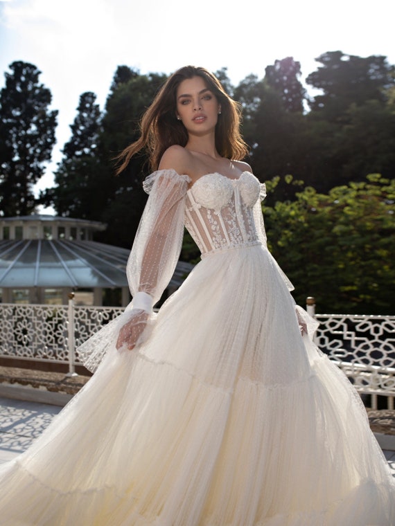 off the shoulder flowy wedding dress
