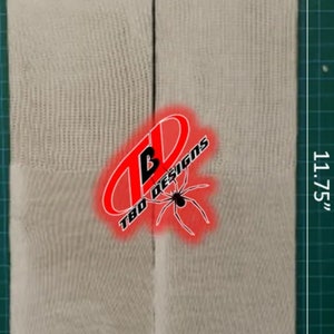 May include: Two white cotton socks with the text "Fruit of the Loom" printed on the bottom. The socks are 11.75 inches tall and 3.25 inches wide.