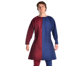 May include: A long-sleeved tunic with a split color design. One half is burgundy and the other half is blue. The tunic is worn over matching pants.