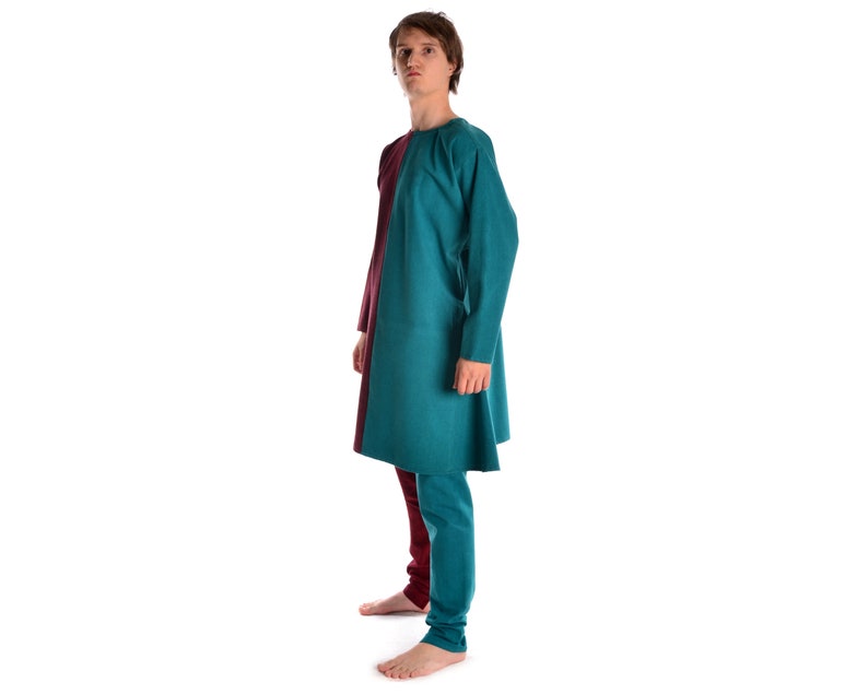 May include: A teal and burgundy tunic with long sleeves and a loose fit. The tunic is made of a soft, comfortable fabric and has a simple, elegant design.